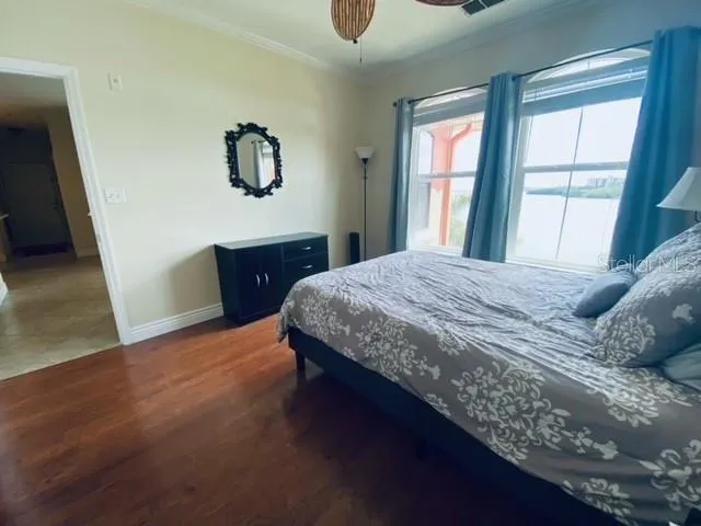 a bedroom with a bed and window