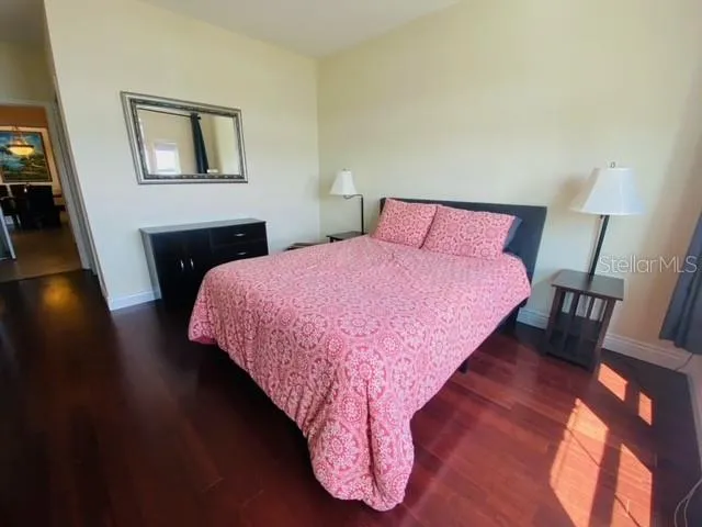 a bedroom with a bed and a table