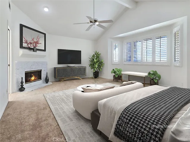 a bedroom with a bed and a fireplace