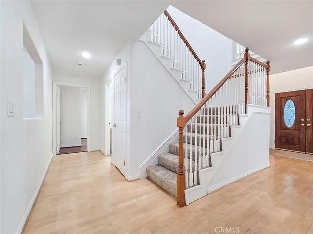 a view of a hallway with staircase