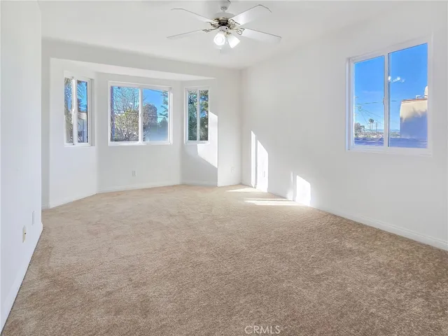 a view of empty room with windows