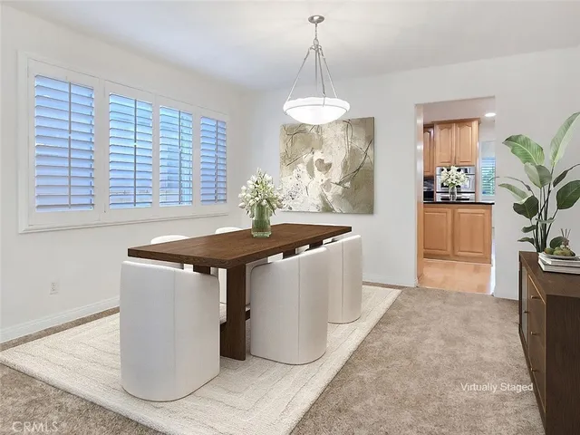 a kitchen with granite countertop a sink a counter and cabinets