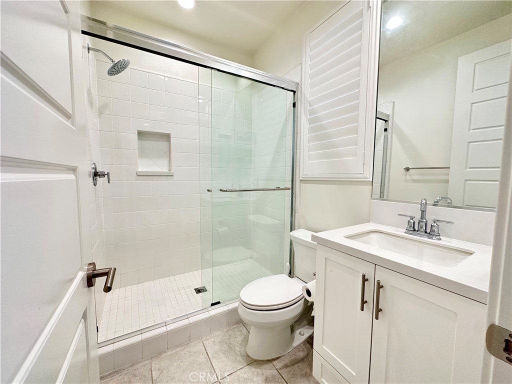 35 Hideaway Loop Mission Viejo, CA 92692 - Photo 12 of 24 a bathroom with a sink a toilet and shower