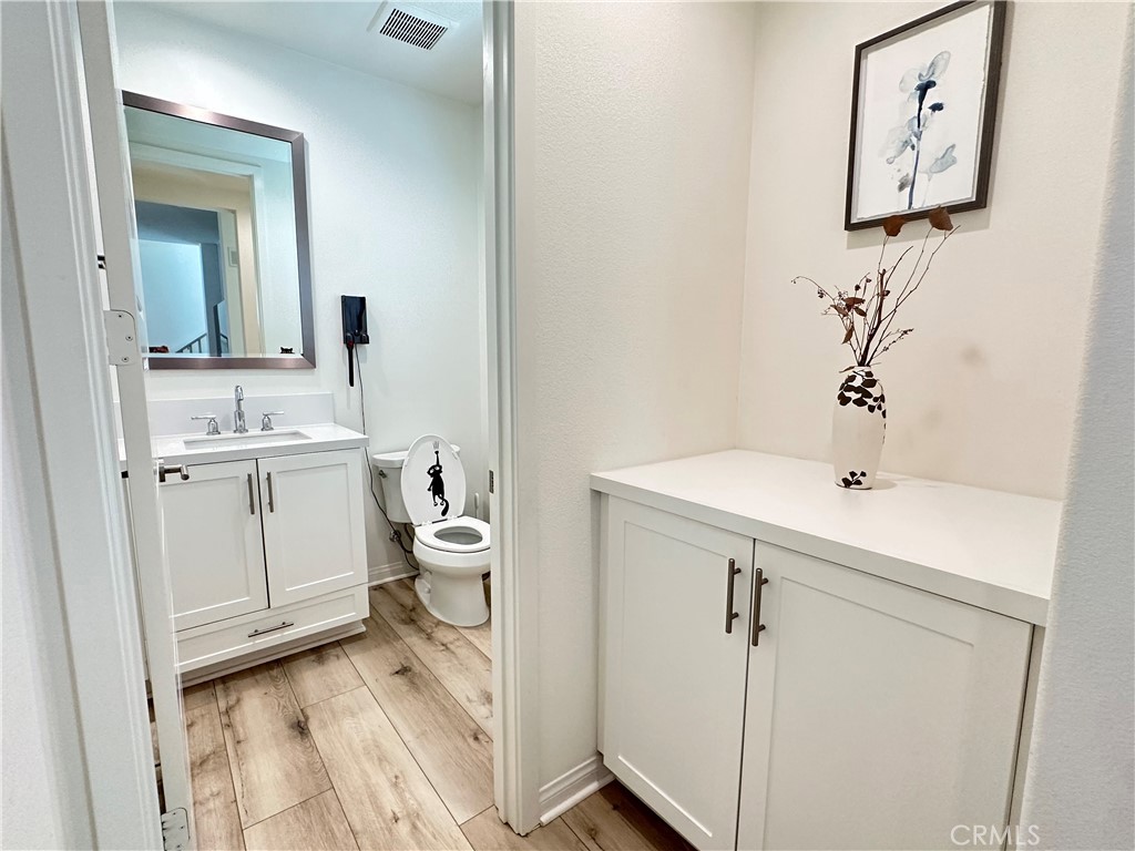 35 Hideaway Loop Mission Viejo, CA 92692 - Photo 13 of 24 a bathroom with a sink a toilet and mirror