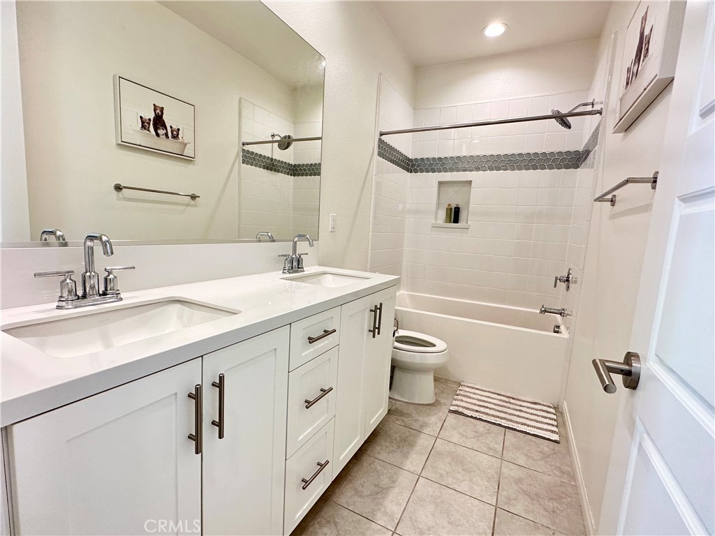 35 Hideaway Loop Mission Viejo, CA 92692 - Photo 14 of 24 a bathroom with a granite countertop sink toilet and shower
