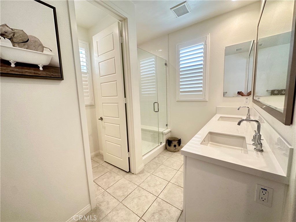 35 Hideaway Loop Mission Viejo, CA 92692 - Photo 16 of 24 a bathroom with a sink and a mirror