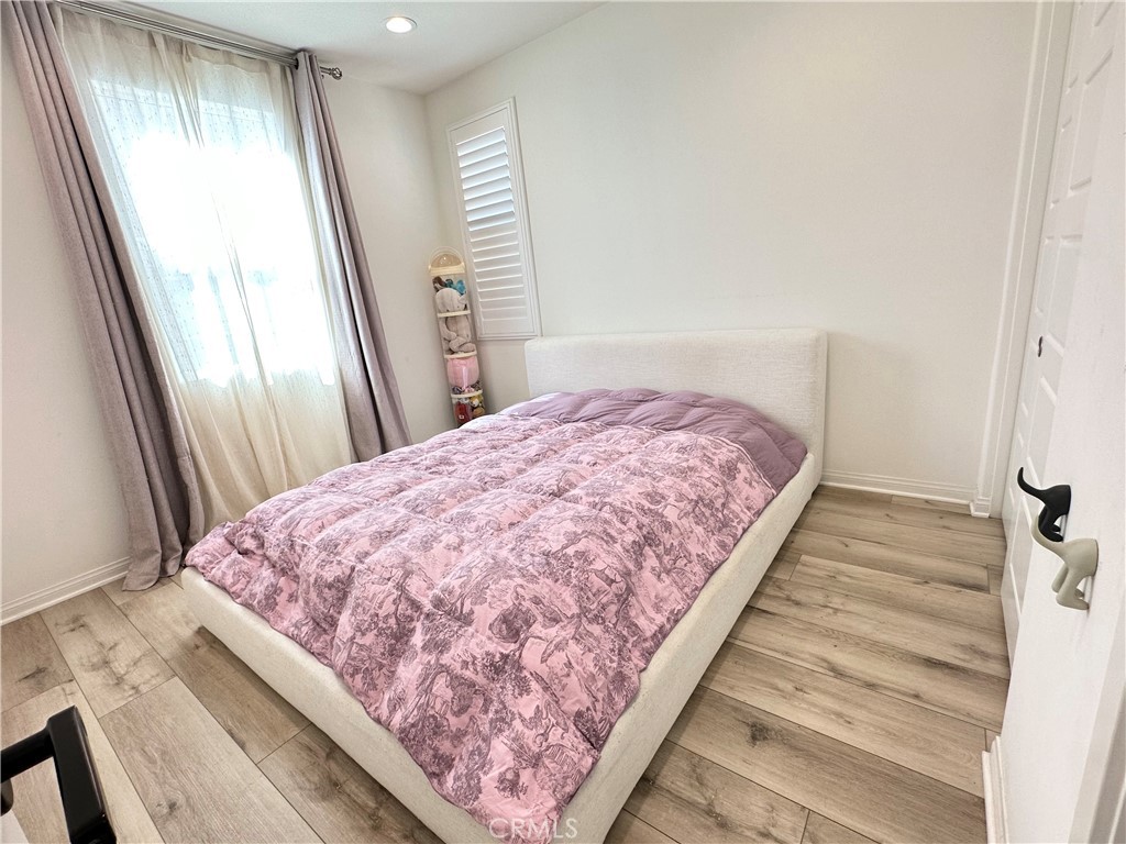 35 Hideaway Loop Mission Viejo, CA 92692 - Photo 8 of 24 a bed sitting in a bedroom next to a window