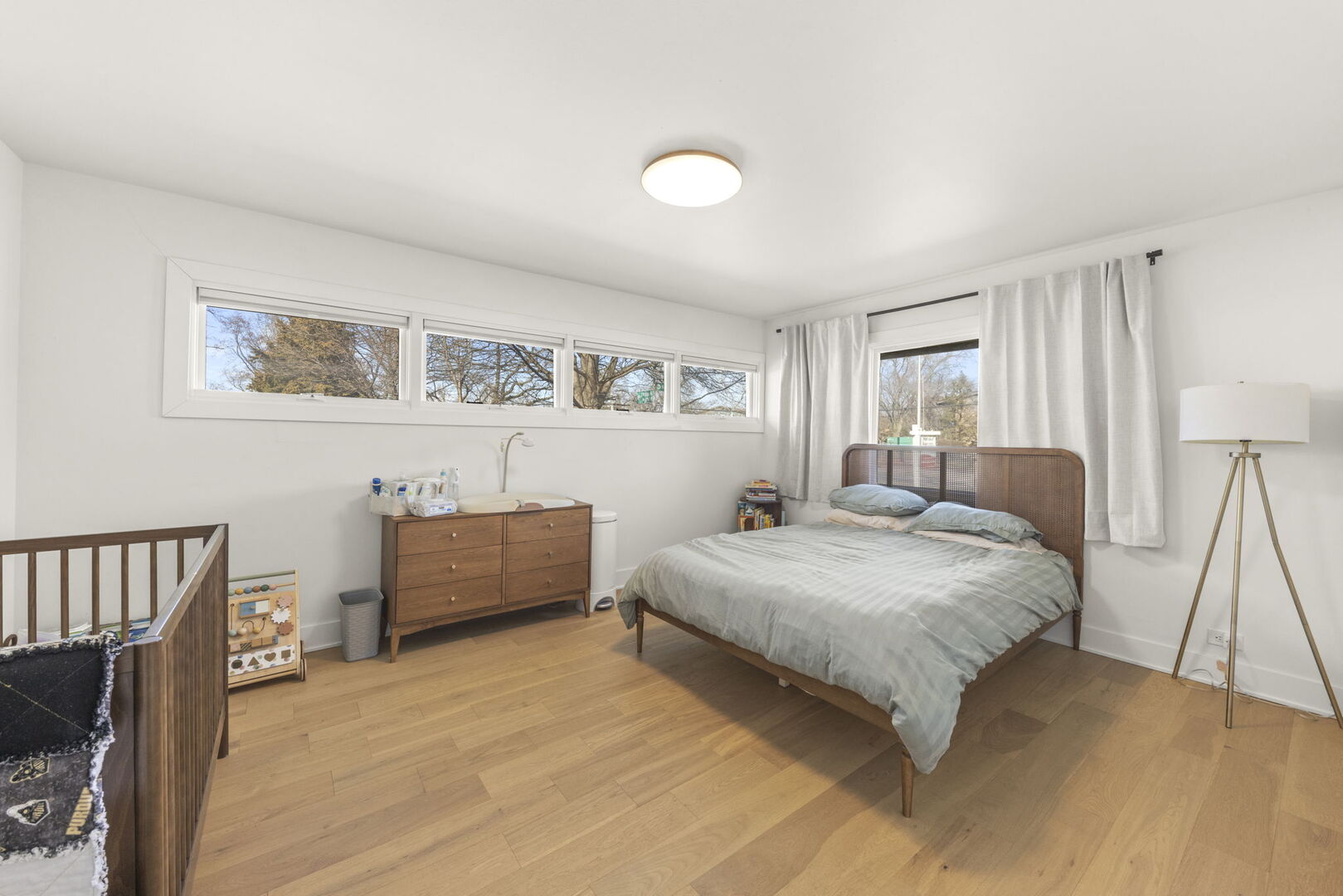 1100 South Westmore-Meyers Road Lombard, IL 60148 - Photo 14 of 28 a bedroom with a bed and a couch