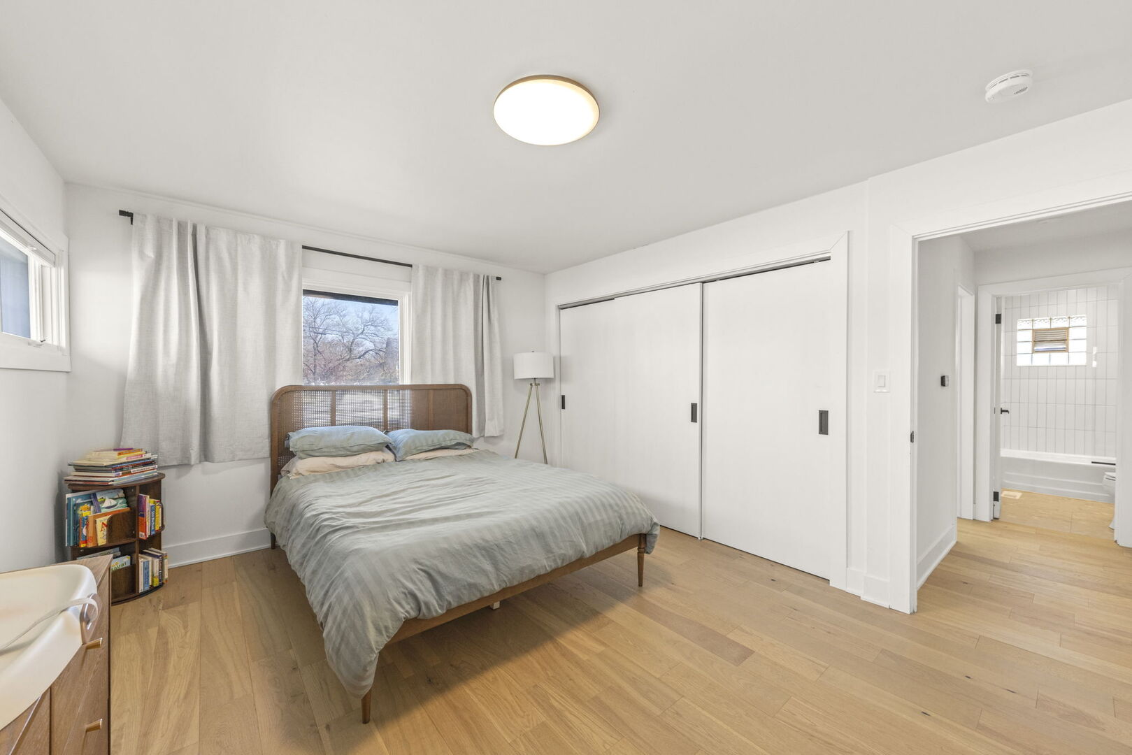 1100 South Westmore-Meyers Road Lombard, IL 60148 - Photo 15 of 28 a bedroom with a bed and a chandelier