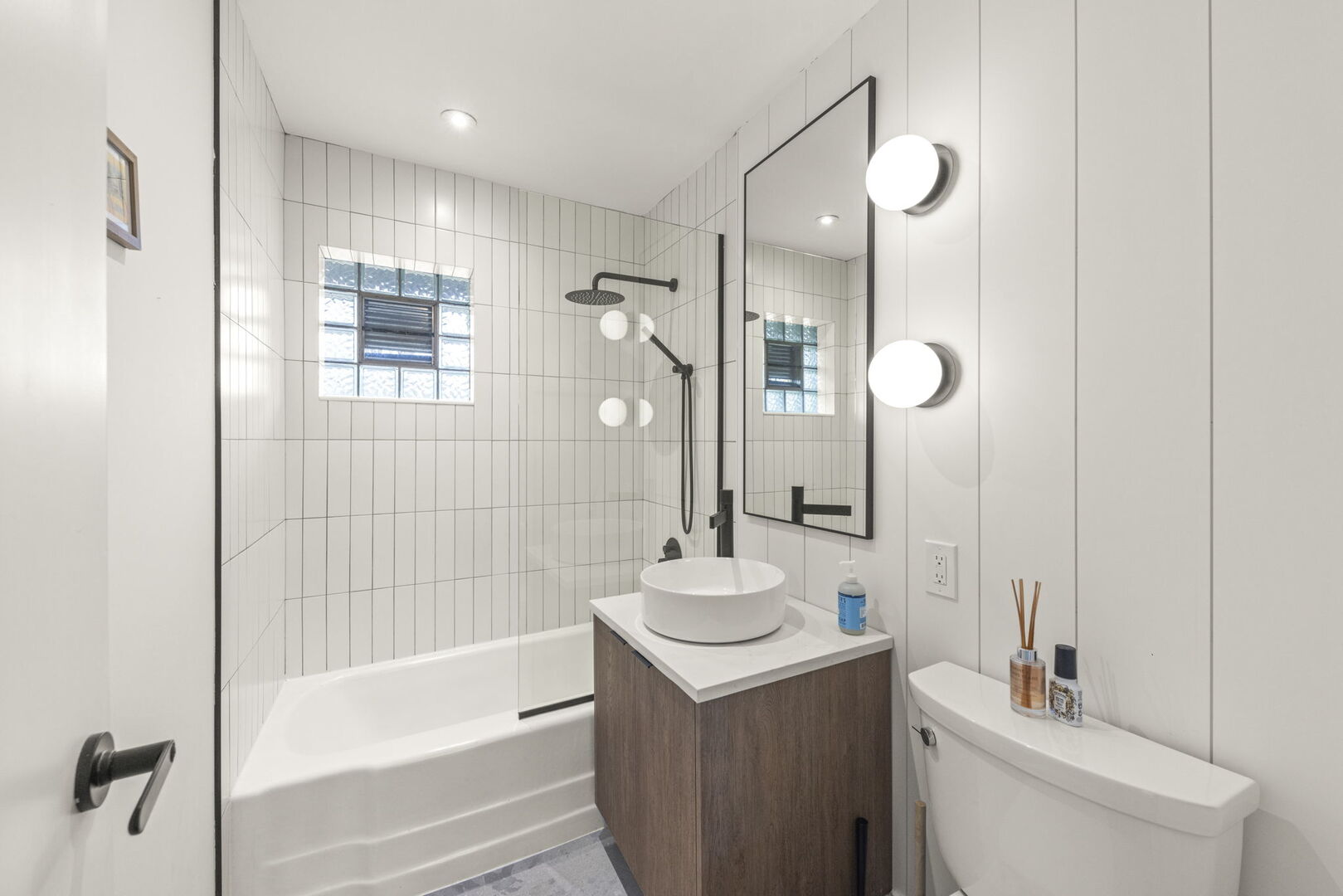 1100 South Westmore-Meyers Road Lombard, IL 60148 - Photo 17 of 28 a bathroom with a sink a toilet and shower