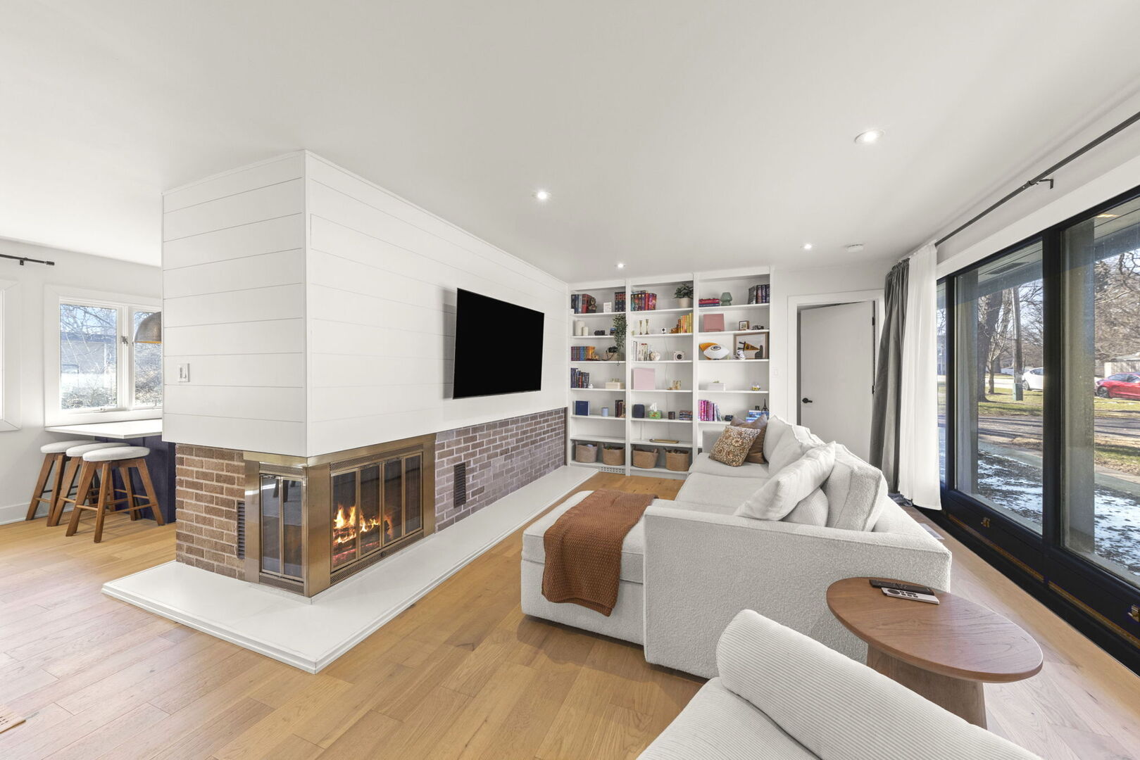 1100 South Westmore-Meyers Road Lombard, IL 60148 - Photo 4 of 28 a living room with furniture and a flat screen tv