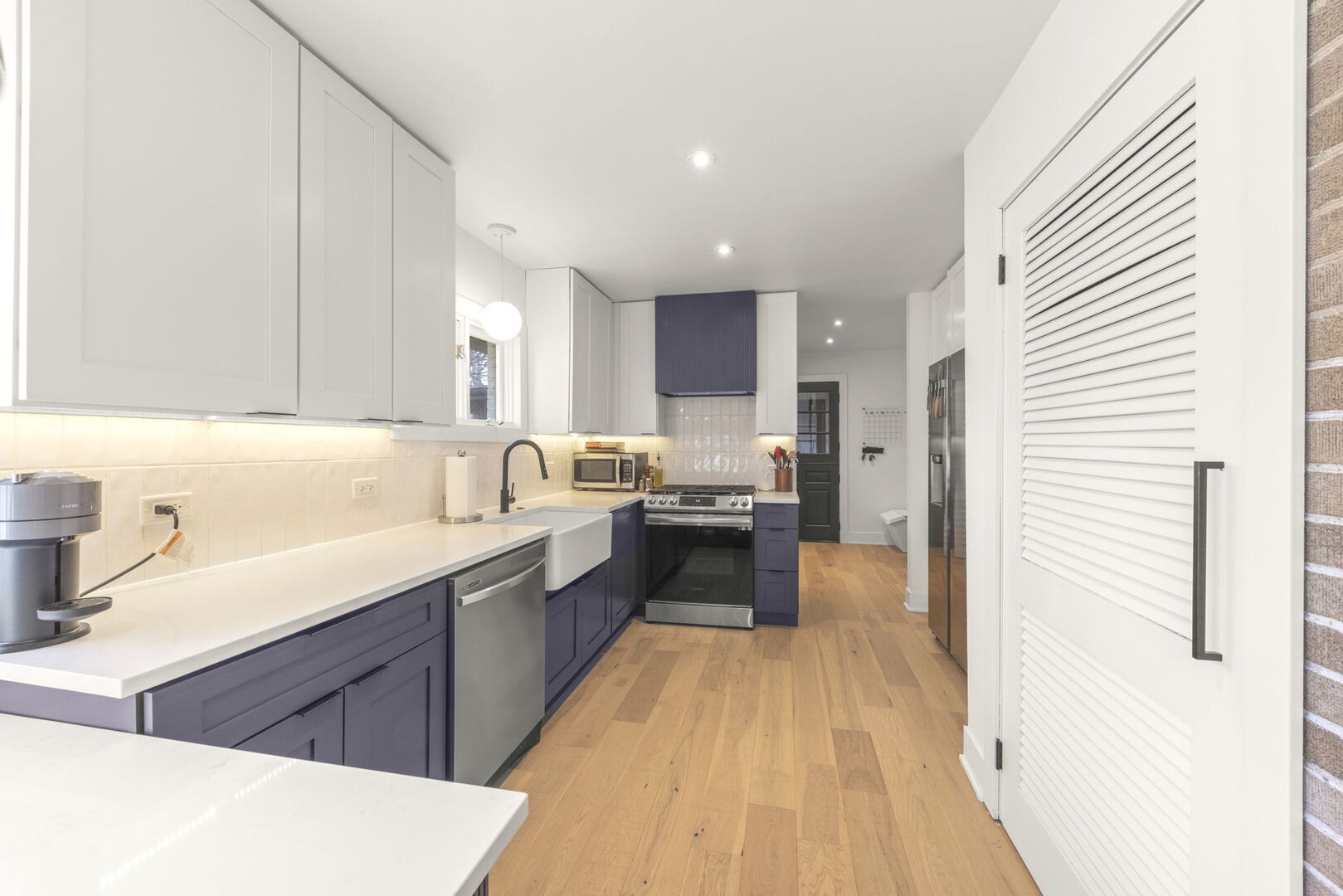 1100 South Westmore-Meyers Road Lombard, IL 60148 - Photo 8 of 28 a kitchen with a sink a counter top space and stainless steel appliances