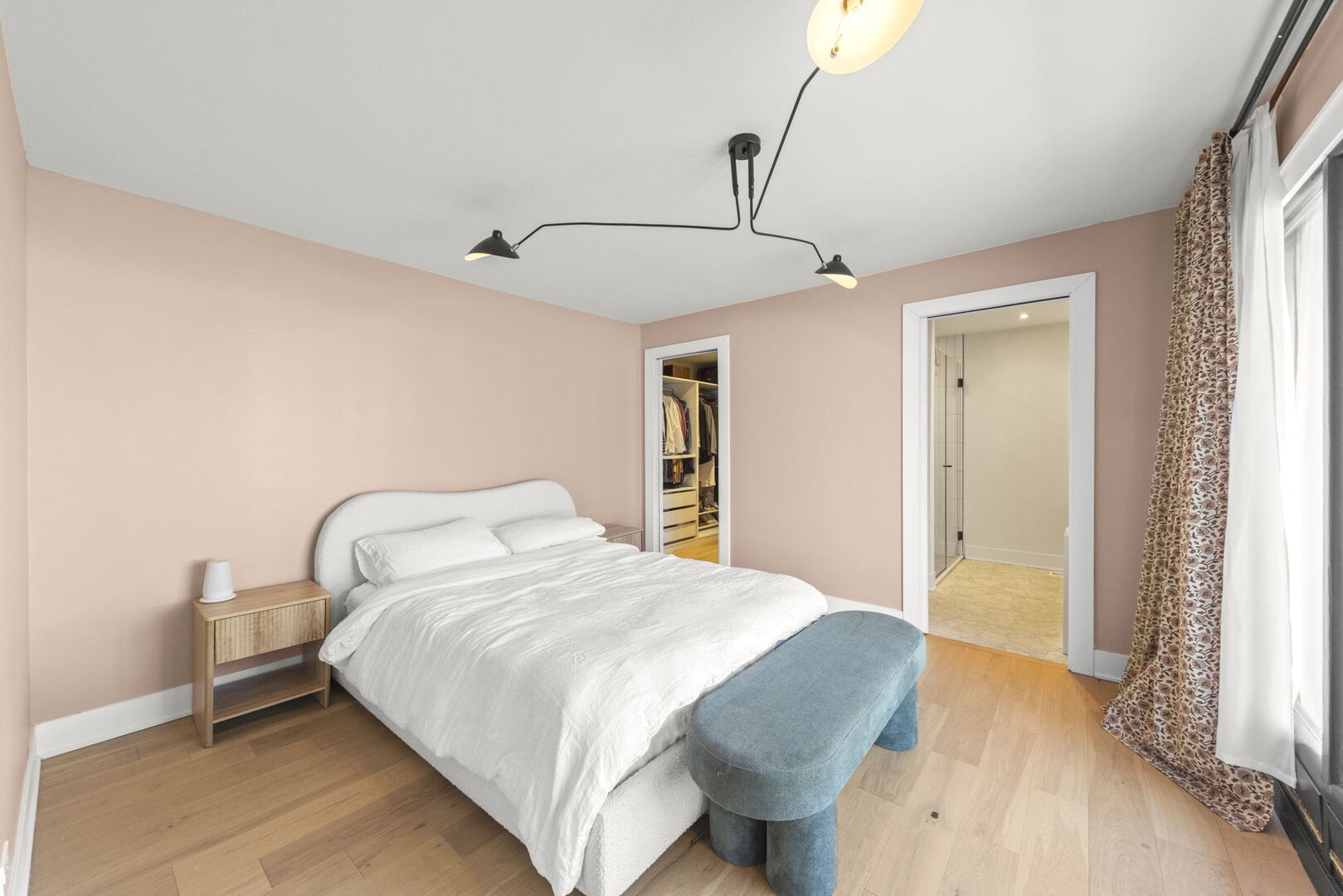 1100 South Westmore-Meyers Road Lombard, IL 60148 - Photo 10 of 28 a bedroom with a bed and a chandelier