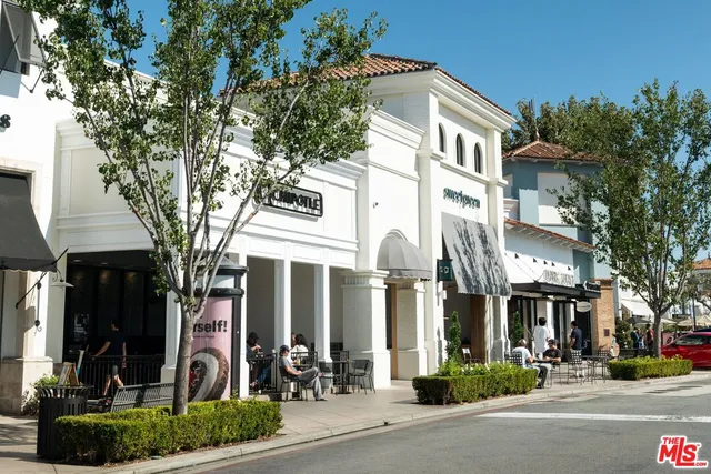 a front view of a building with garden