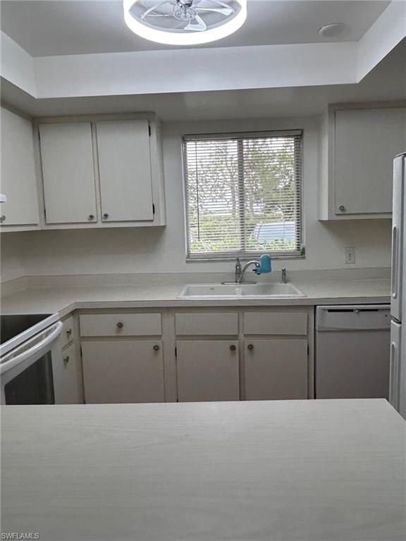 5651 Rattlesnake Hamm Road, Unit C107 Naples, FL 34113 - Photo 9 of 20 KITCHEN AREA VIEW FROM DINING ROOM