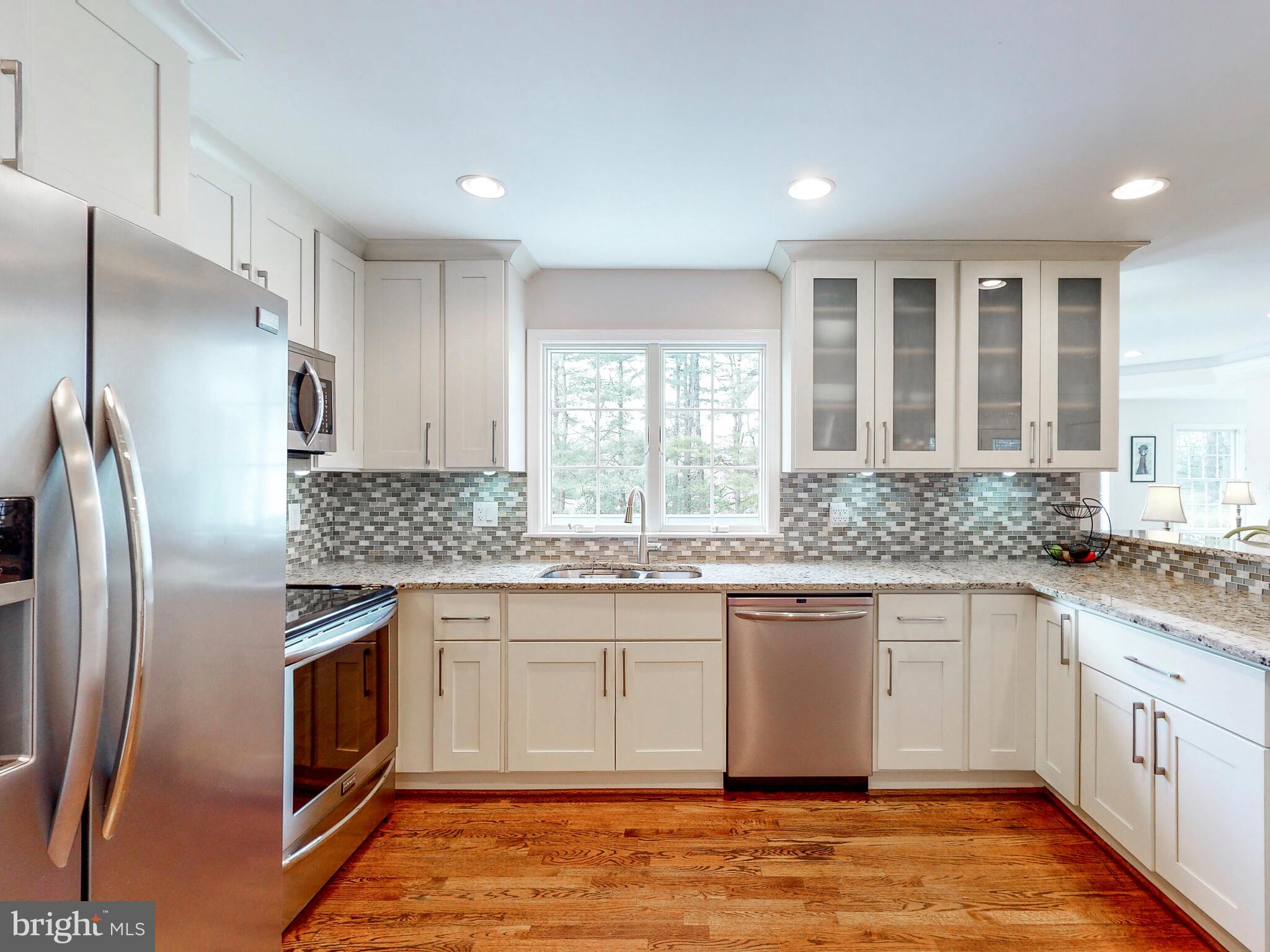 1900 Ridge Road Reisterstown, MD 21136 - Photo 7 of 67 Kitchen with double sink and tile backsplash