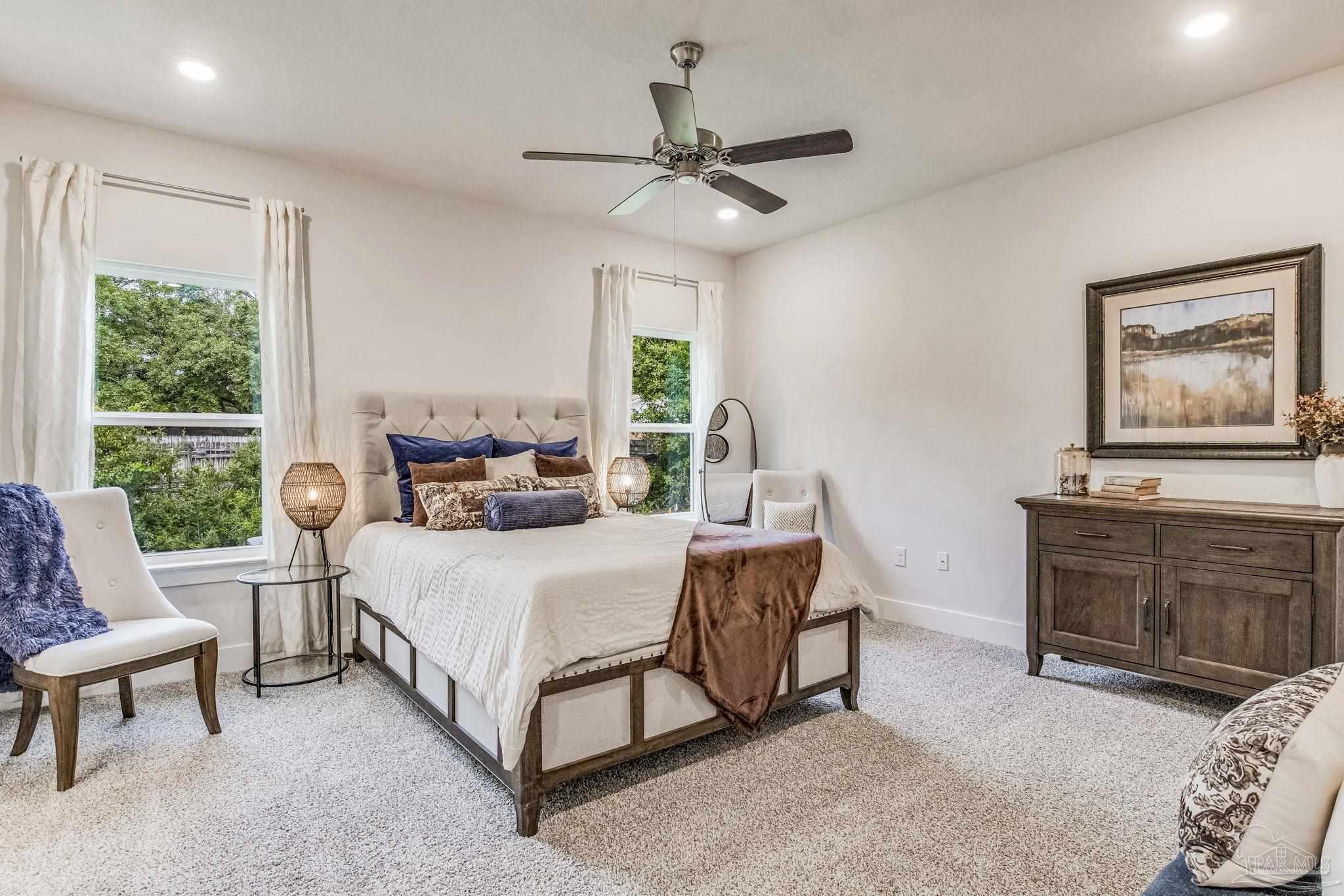 3861 Eagle Tail Drive Jay, FL 32565 - Photo 14 of 20 a bedroom with a bed and a couch