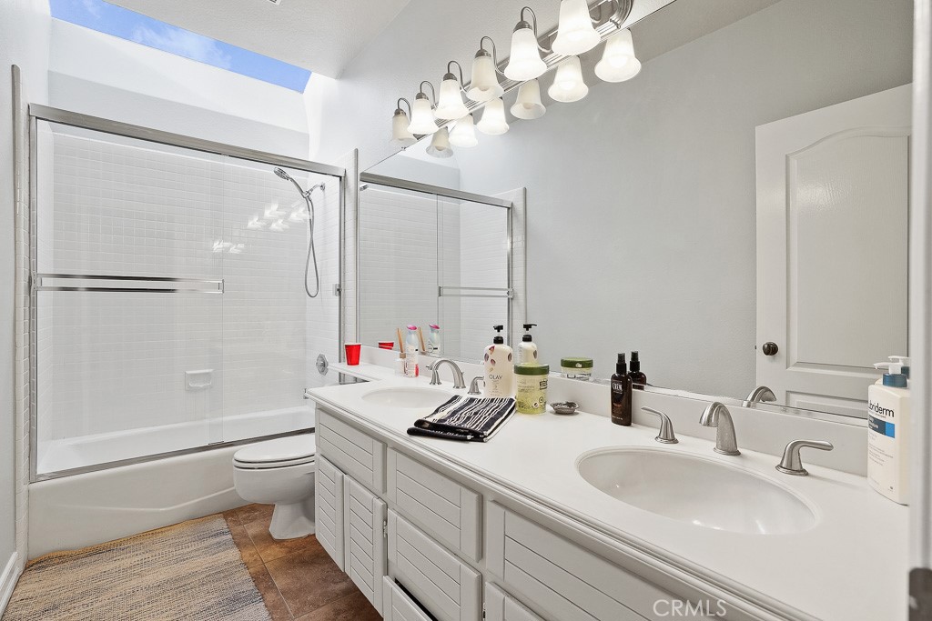 58 Via Candelaria Coto de Caza, CA 92679 - Photo 12 of 17 a bathroom with a sink a toilet and a mirror