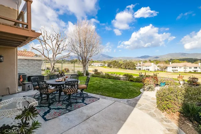 a view of a patio with a table chairs and a table