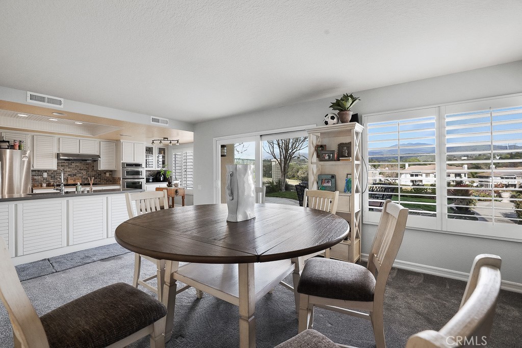 58 Via Candelaria Coto de Caza, CA 92679 - Photo 7 of 17 a dining room with furniture and wooden floor