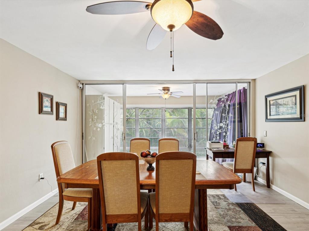 1433 South Belcher Road, Unit F20 Clearwater, FL 33764 - Photo 11 of 57 a view of a dining room with furniture window and outside view