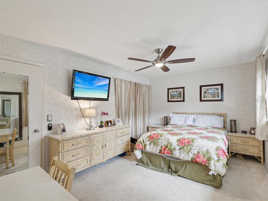 1433 South Belcher Road, Unit F20 Clearwater, FL 33764 - Photo 16 of 57 a bedroom with a bed bathroom and window