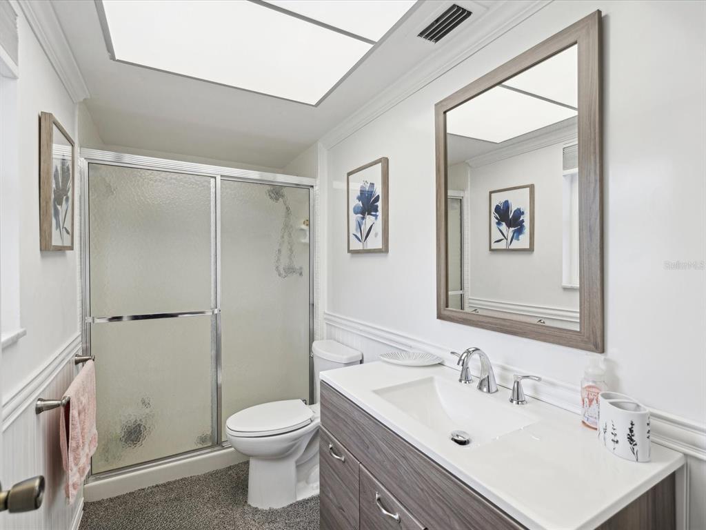 1433 South Belcher Road, Unit F20 Clearwater, FL 33764 - Photo 17 of 57 a bathroom with a sink toilet and shower