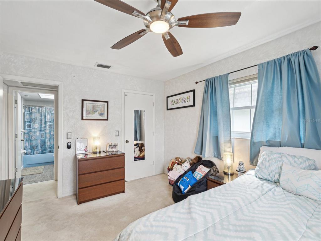 1433 South Belcher Road, Unit F20 Clearwater, FL 33764 - Photo 21 of 57 a bedroom with bed and window