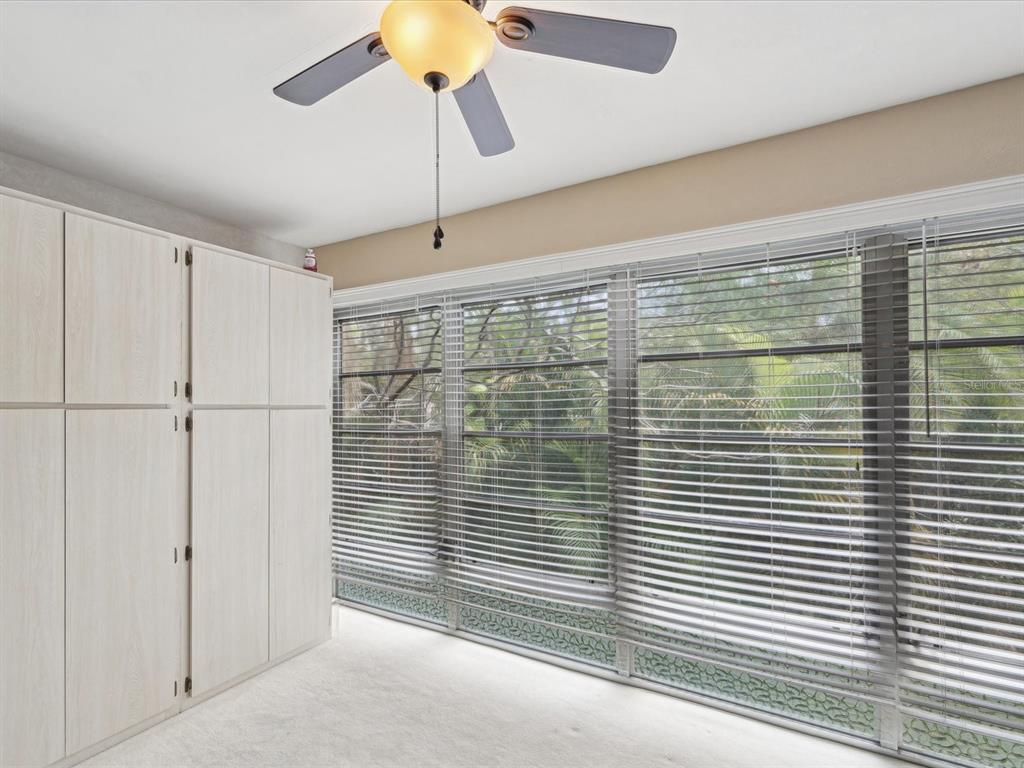 1433 South Belcher Road, Unit F20 Clearwater, FL 33764 - Photo 25 of 57 a view of a glass door and a window