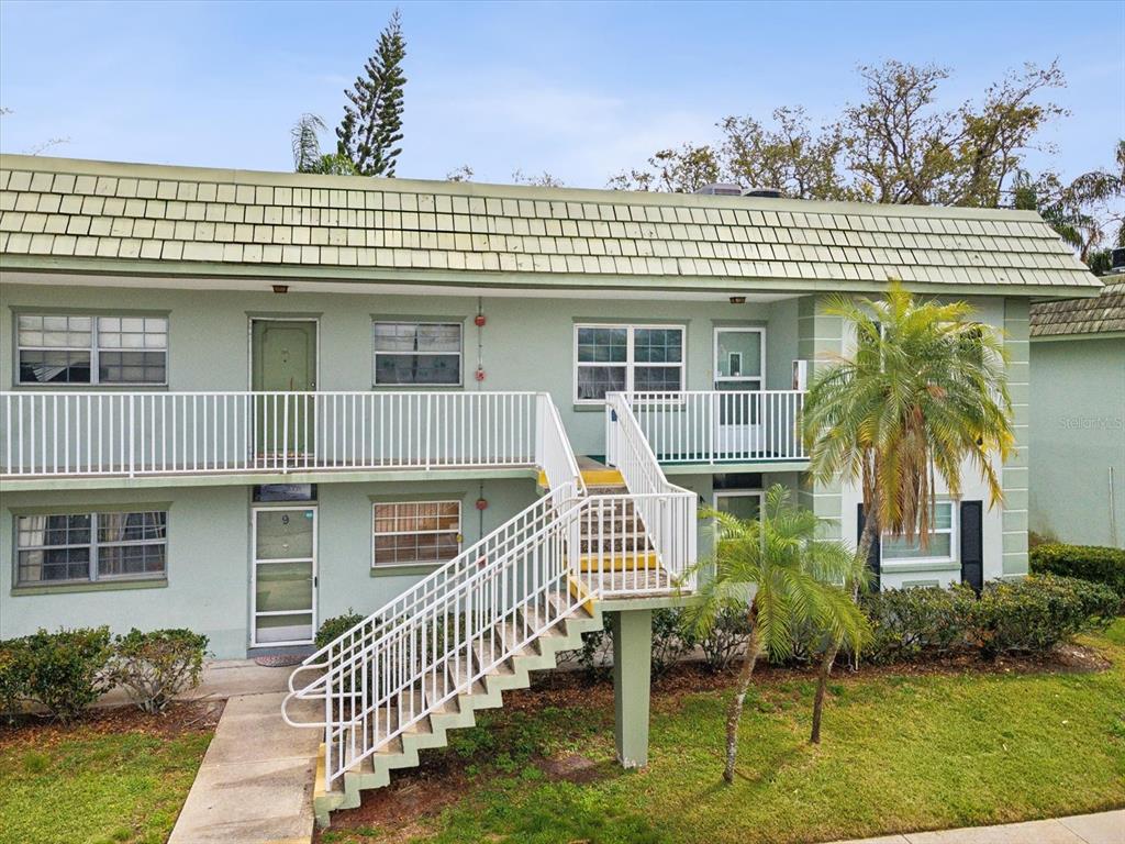 1433 South Belcher Road, Unit F20 Clearwater, FL 33764 - Photo 36 of 57 a front view of a house with a porch