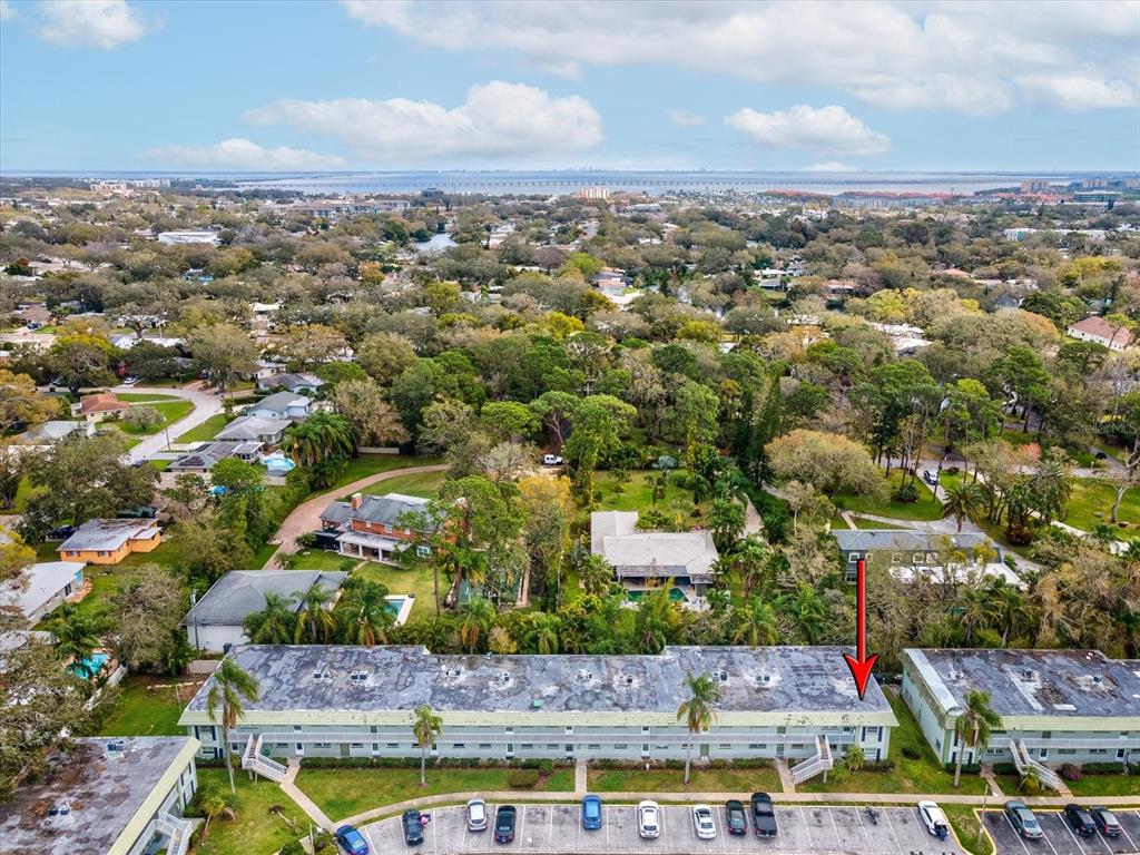 1433 South Belcher Road, Unit F20 Clearwater, FL 33764 - Photo 39 of 57 an aerial view of residential houses with swimming pool