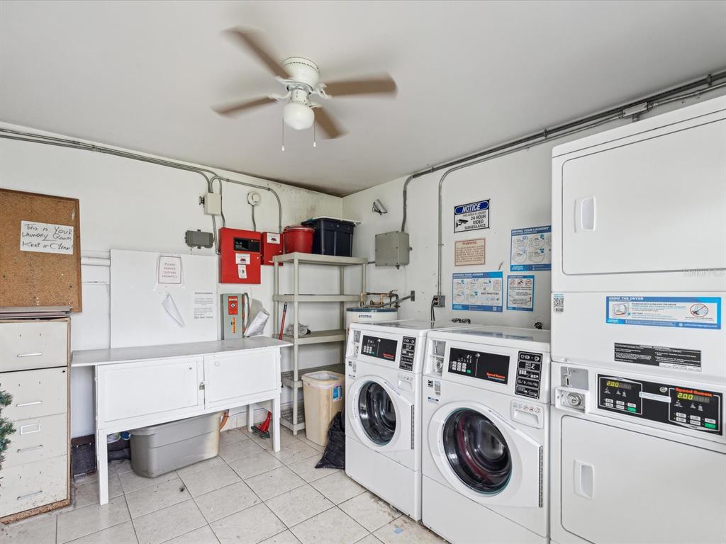 1433 South Belcher Road, Unit F20 Clearwater, FL 33764 - Photo 40 of 57 a view of storage and utility room with washer and dryer