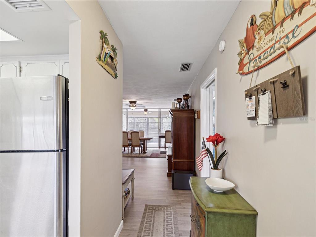 1433 South Belcher Road, Unit F20 Clearwater, FL 33764 - Photo 4 of 57 a living room with furniture and a wooden floor