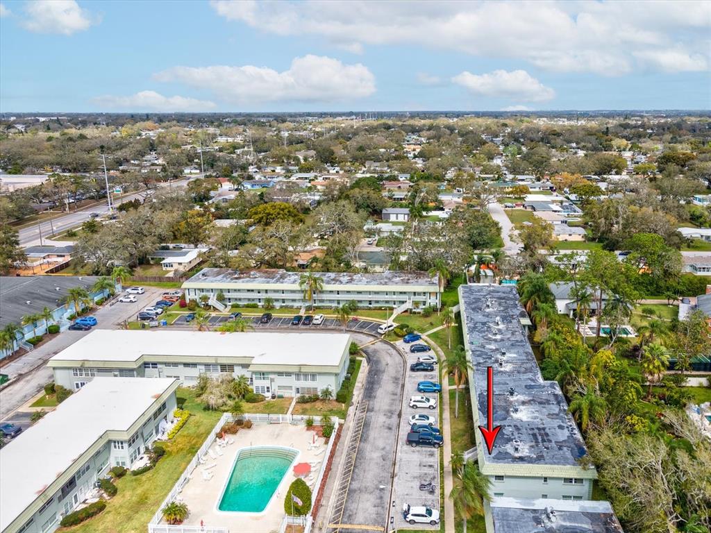 1433 South Belcher Road, Unit F20 Clearwater, FL 33764 - Photo 51 of 57 an aerial view of residential houses with outdoor space