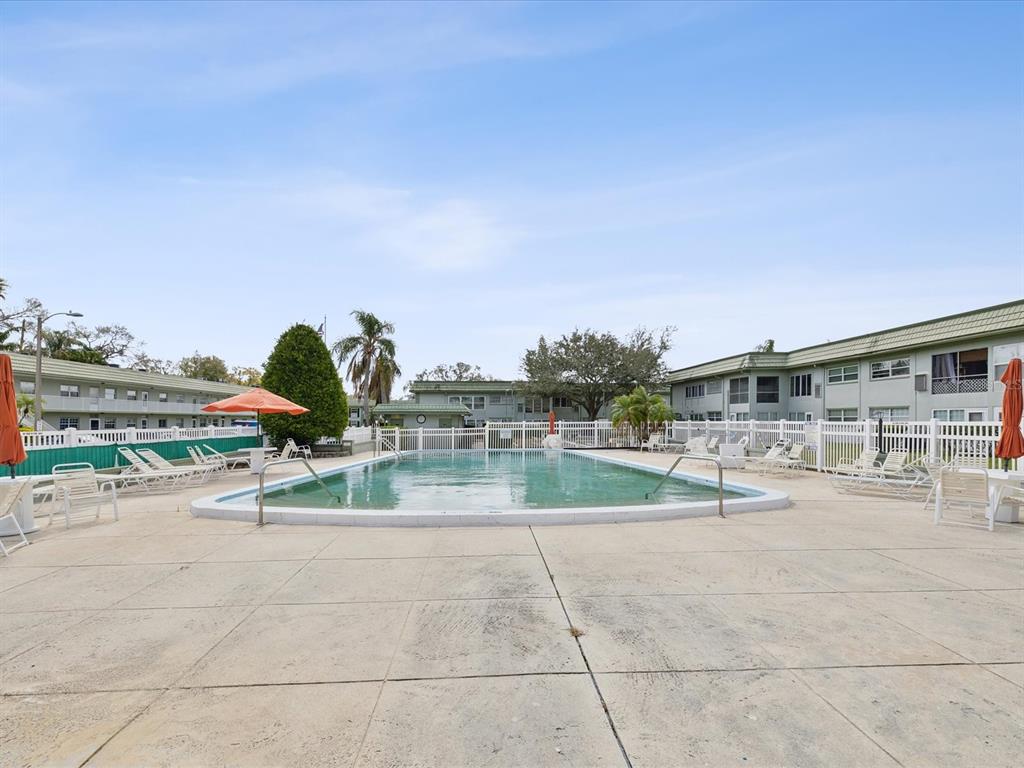 1433 South Belcher Road, Unit F20 Clearwater, FL 33764 - Photo 53 of 57 a view of house with outdoor space and porch