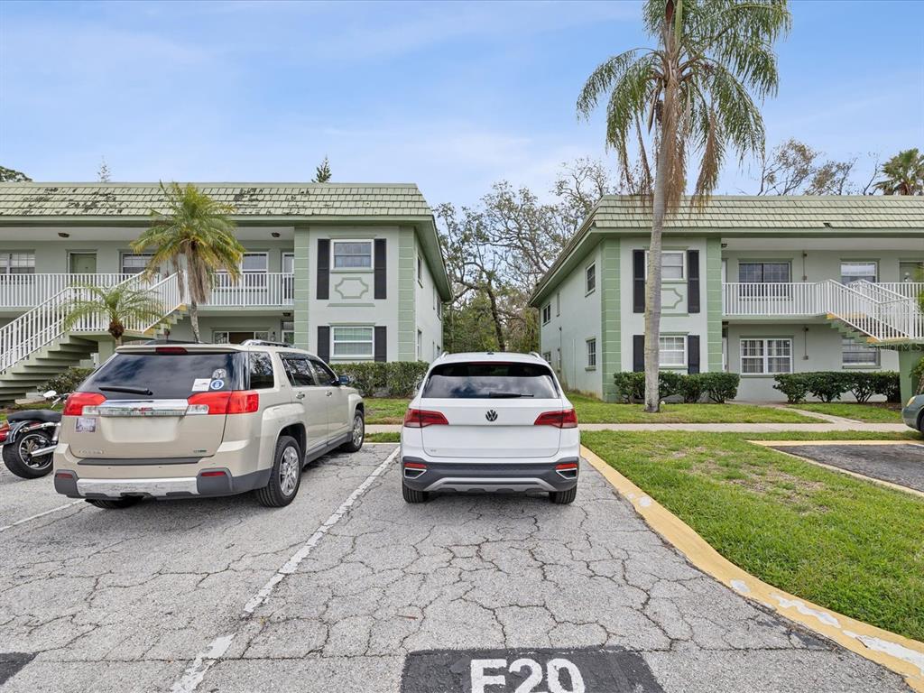 1433 South Belcher Road, Unit F20 Clearwater, FL 33764 - Photo 57 of 57 a view of a car park in front of a house