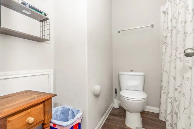 a white toilet sitting next to a bathroom sink