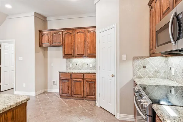 a view of kitchen with granite countertop furniture and a fireplace