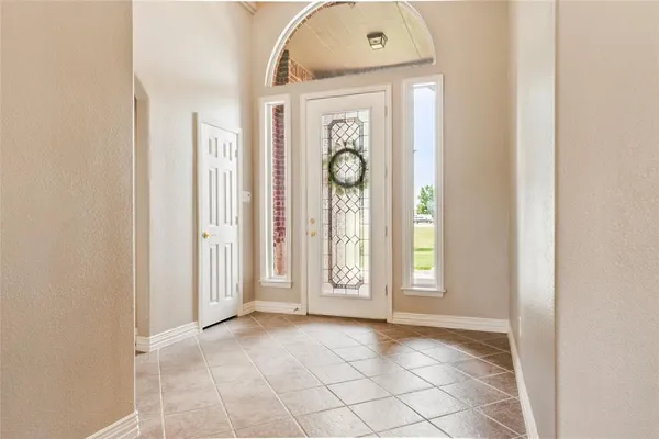 a view of an entryway with wooden floor