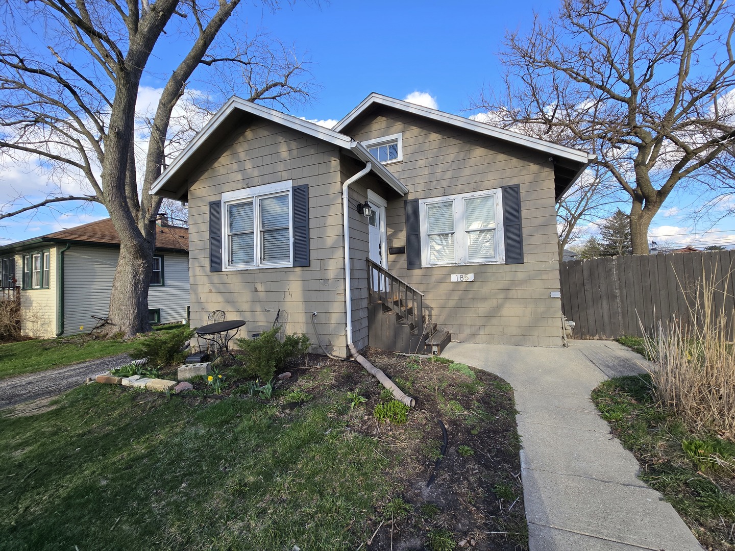 185 Pick Avenue Elmhurst, IL 60126 - Photo 1 of 24 a front view of a house with garden