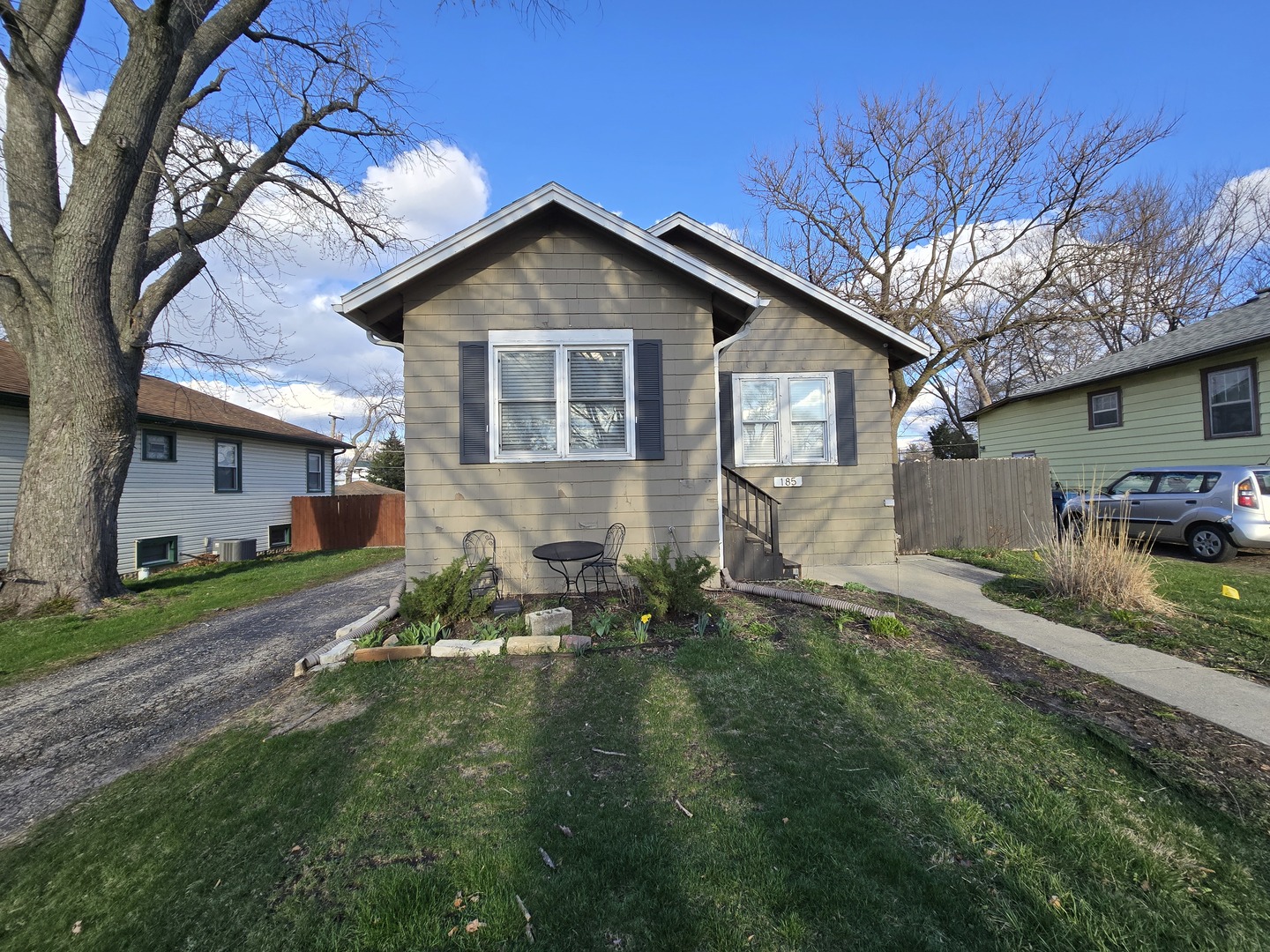 185 Pick Avenue Elmhurst, IL 60126 - Photo 3 of 24 a front view of a house with a yard