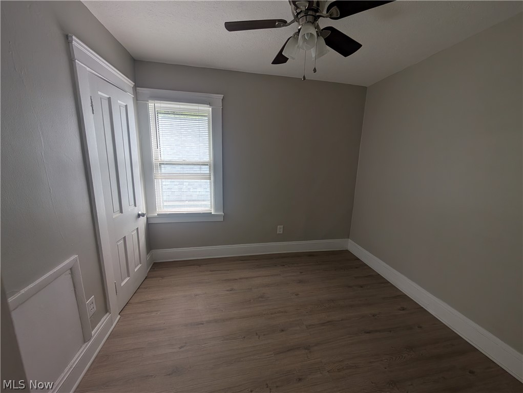 7515 Ottawa Road Cleveland, OH 44105 - Photo 18 of 21 Room featuring light wood-finish flooring, neutral gray walls, and white trim