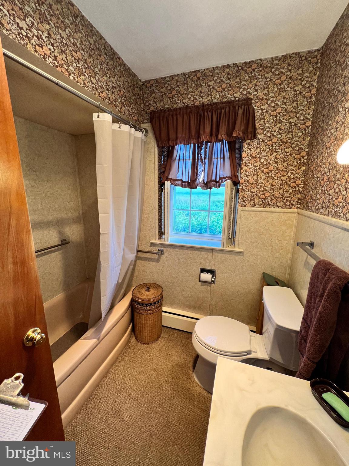 252 Doe Run Road Manheim, PA 17545 - Photo 14 of 32 a bathroom with a toilet a sink and a shower