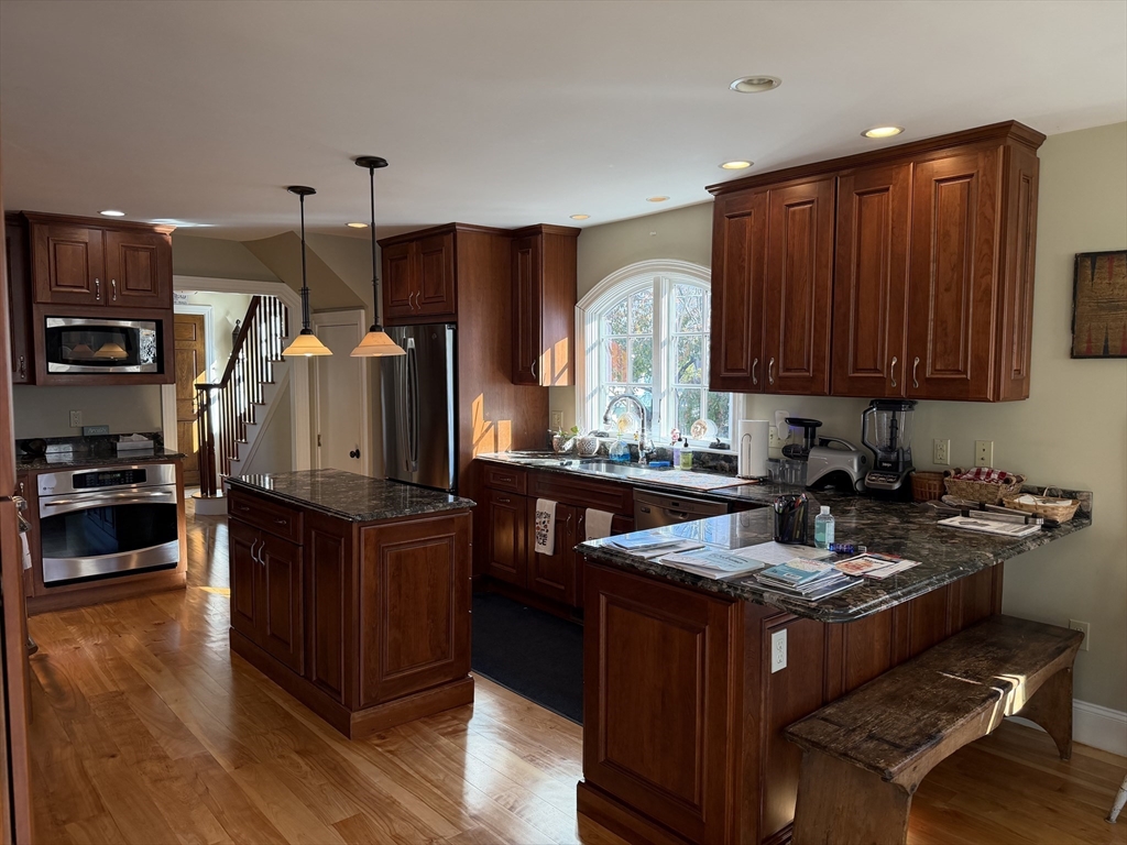 17 Central Street Marblehead, MA 01945 - Photo 2 of 21 a kitchen with granite countertop lots of counter top space and stainless steel appliances