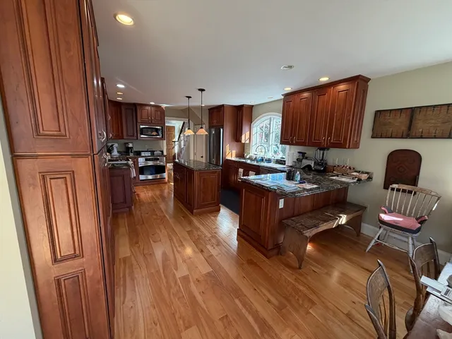 a living room with furniture fireplace and view