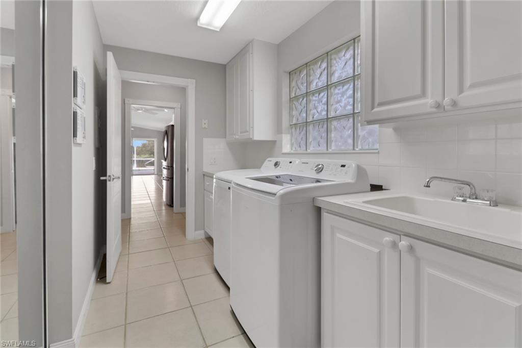 3751 Exuma Way Naples, FL 34119 - Photo 13 of 33 a utility room with dryer and washer