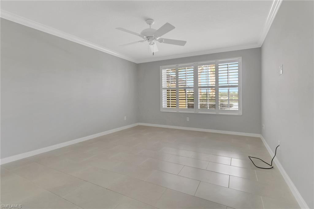 3751 Exuma Way Naples, FL 34119 - Photo 17 of 33 a view of an empty room with a window