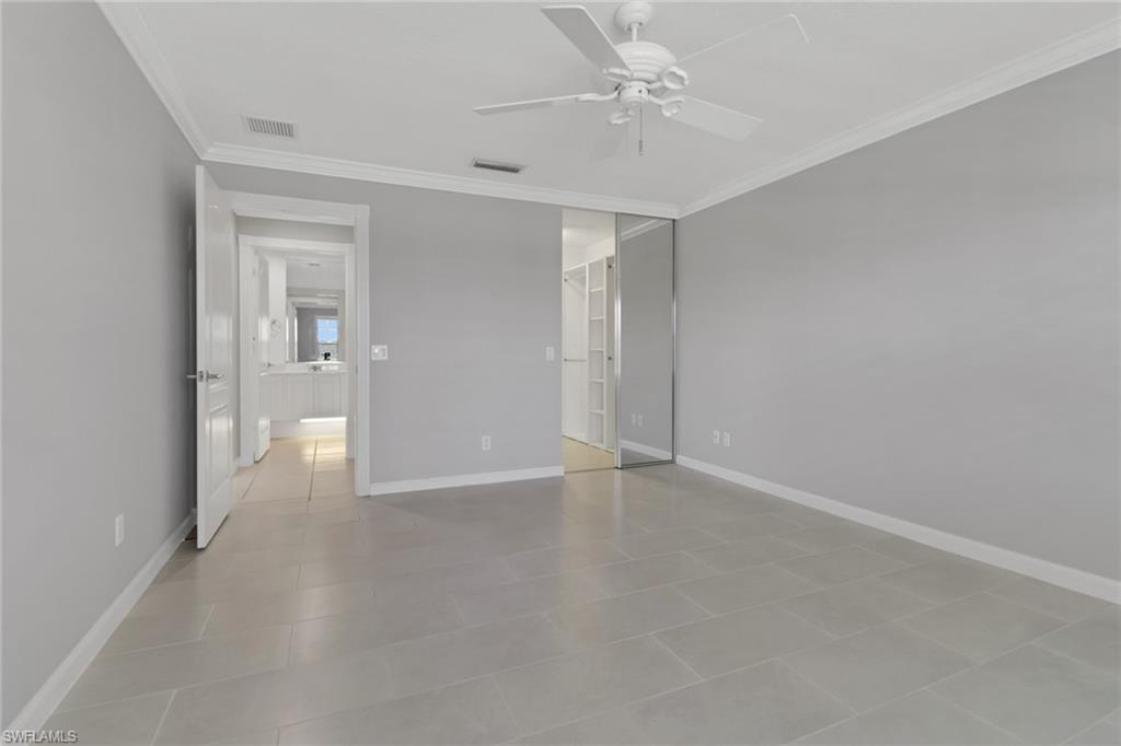 3751 Exuma Way Naples, FL 34119 - Photo 18 of 33 wooden floor in an empty room