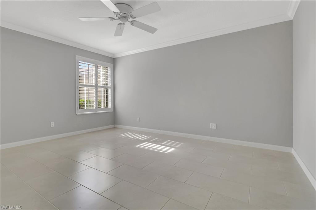3751 Exuma Way Naples, FL 34119 - Photo 19 of 33 a view of an empty room with a window