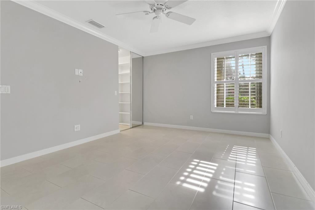 3751 Exuma Way Naples, FL 34119 - Photo 20 of 33 a view of an empty room with a window